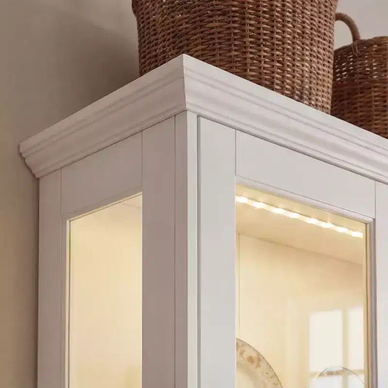 Bibliothèque-vitrine blanche avec éclairage LED RGB, tiroirs et portes vitrées